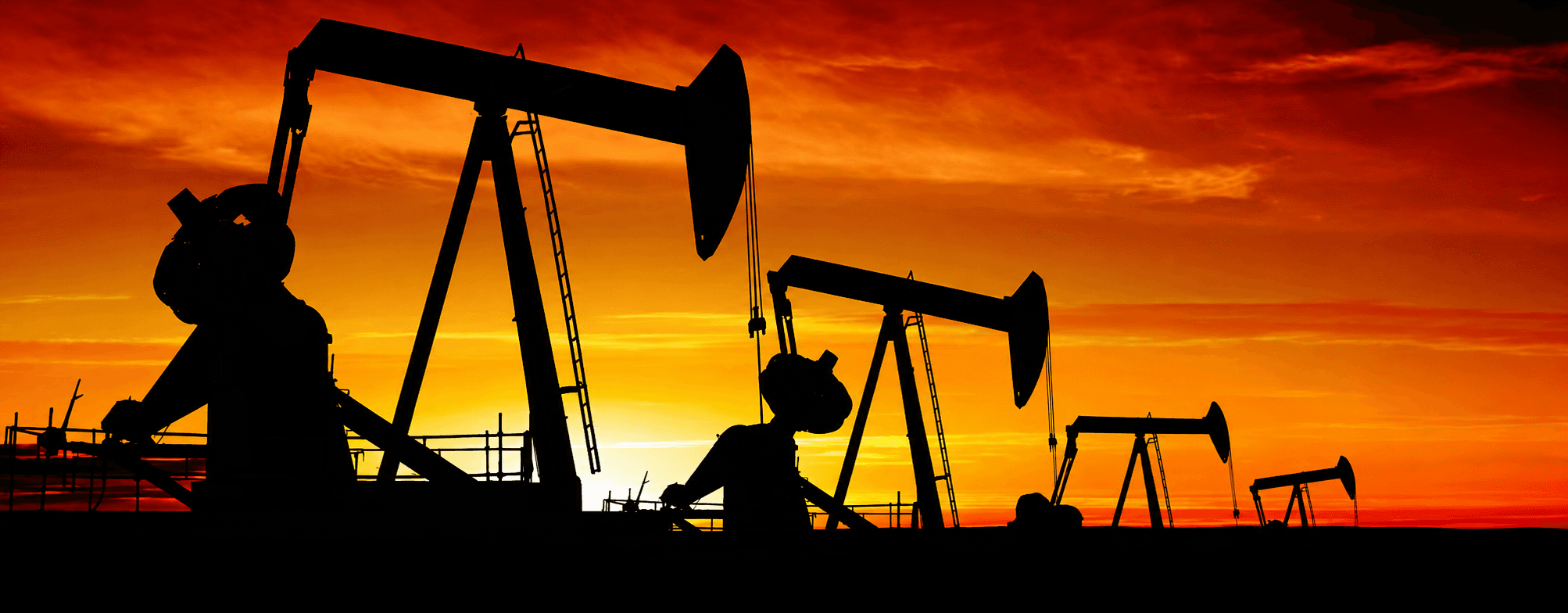 Oilfield pumpjacks at sunset